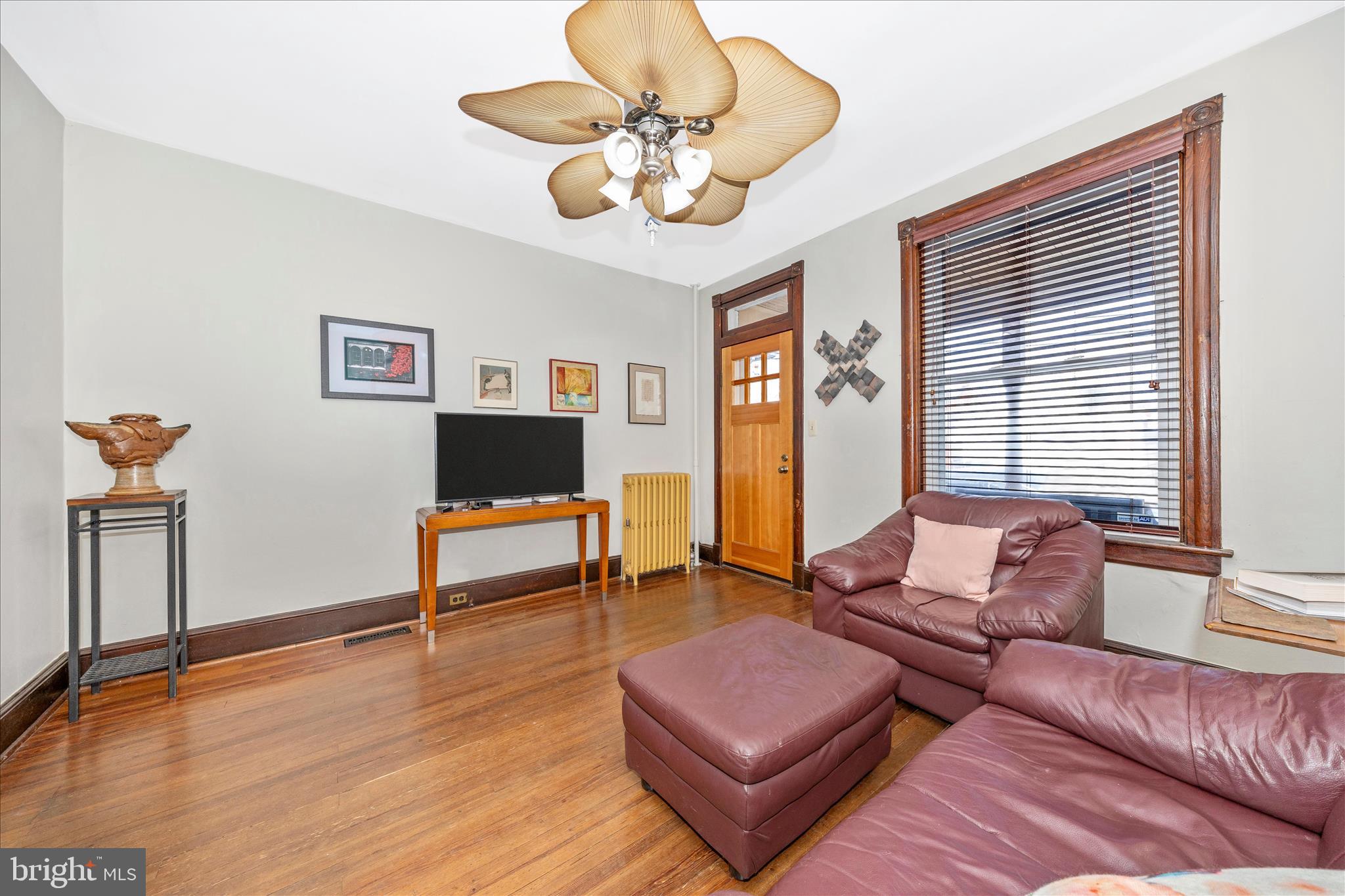 24 East 8th Street Frederick, MD 21701 - Photo 11 of 51 a living room with furniture and a flat screen tv