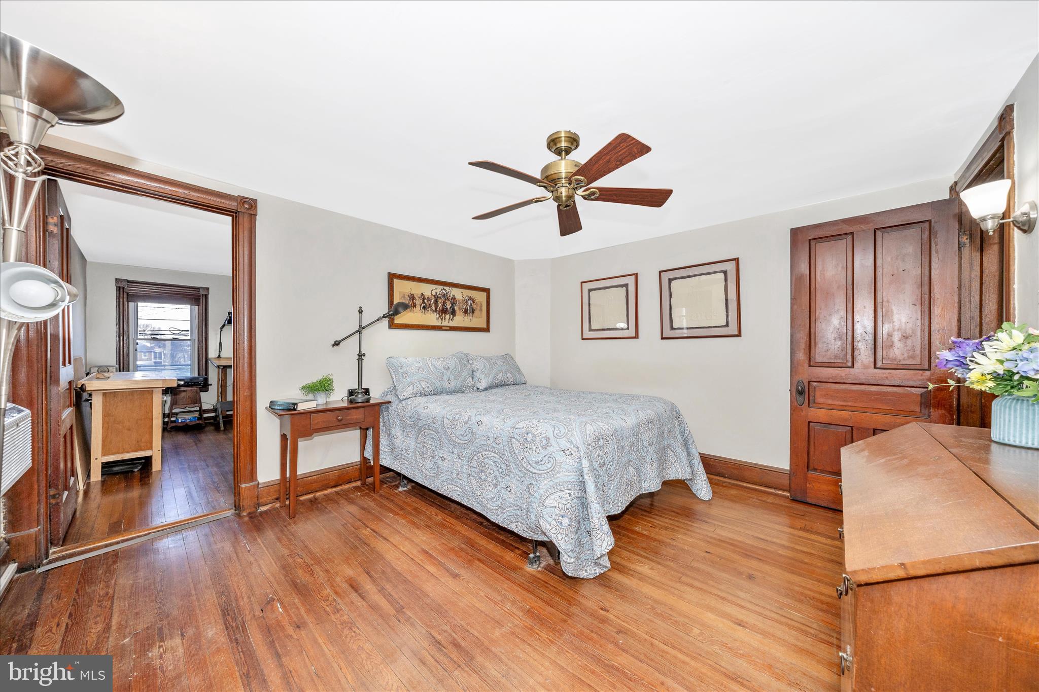 24 East 8th Street Frederick, MD 21701 - Photo 25 of 51 a spacious bedroom with a bed and a view of living room