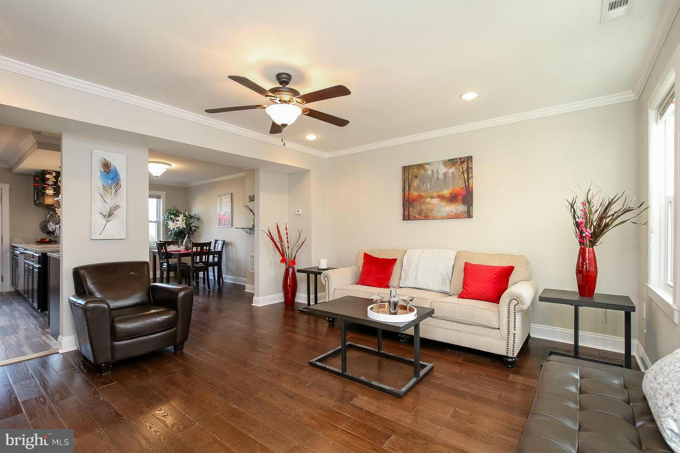 5405 Hillen Road Baltimore, MD 21239 - Photo 4 of 27 a living room with furniture and a wooden floor