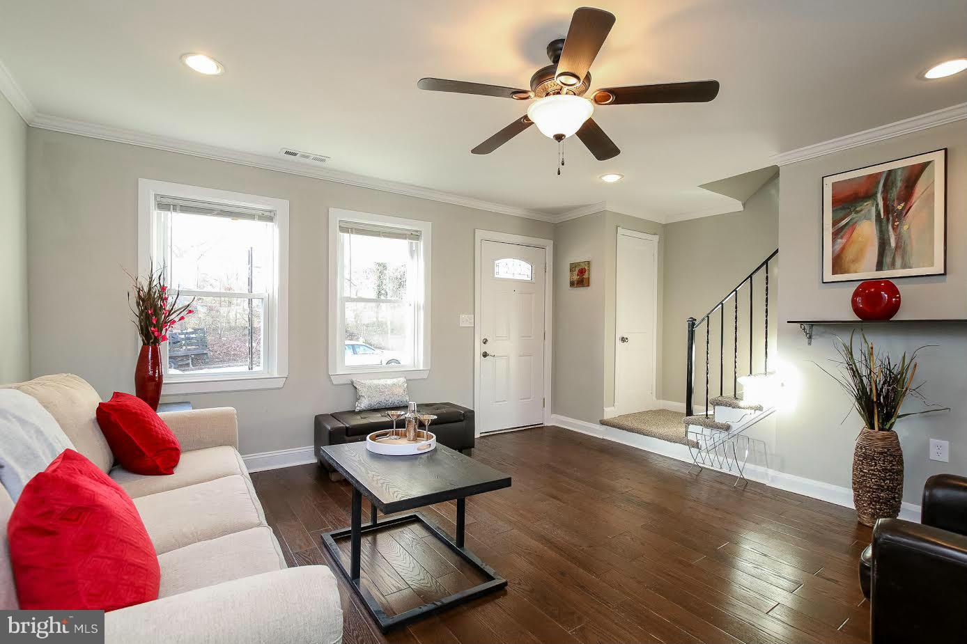 5405 Hillen Road Baltimore, MD 21239 - Photo 6 of 27 a living room with furniture and wooden floor