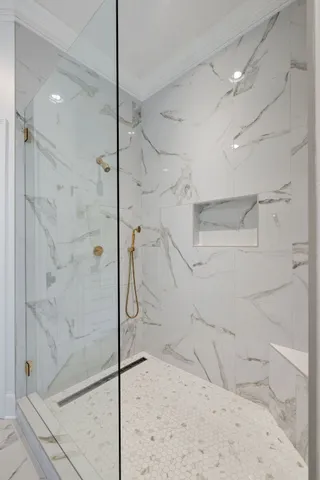 a bedroom with a bed and a lamp