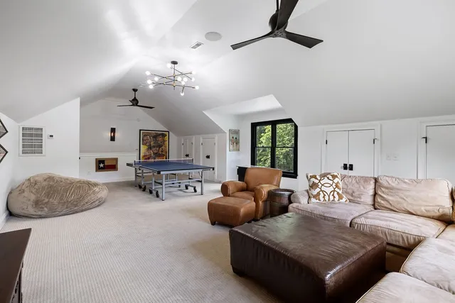 a bedroom with a bed and a lamp