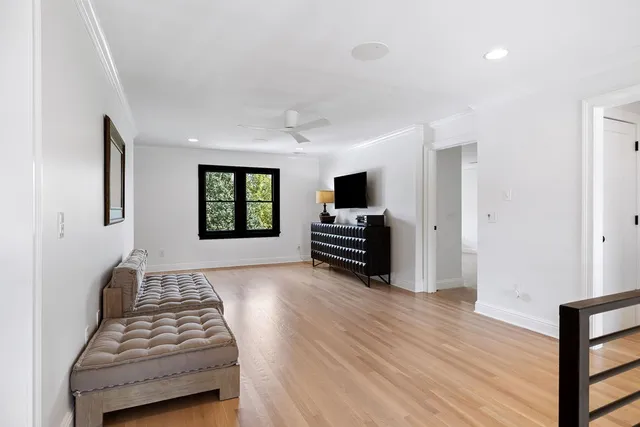 an aerial view of a house with a yard and lake view