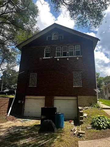 a view of a kitchen with wooden floor and electronic appliances