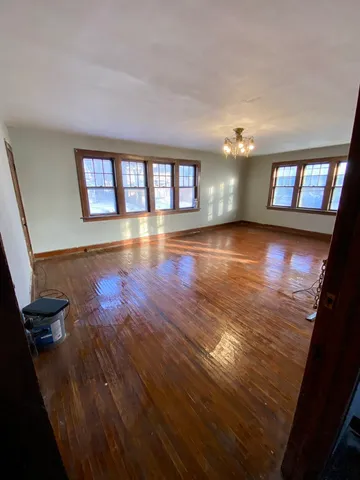 a view of an empty room and a window