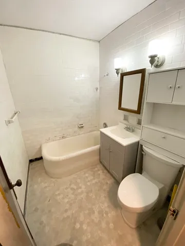 a view of an empty room and a window