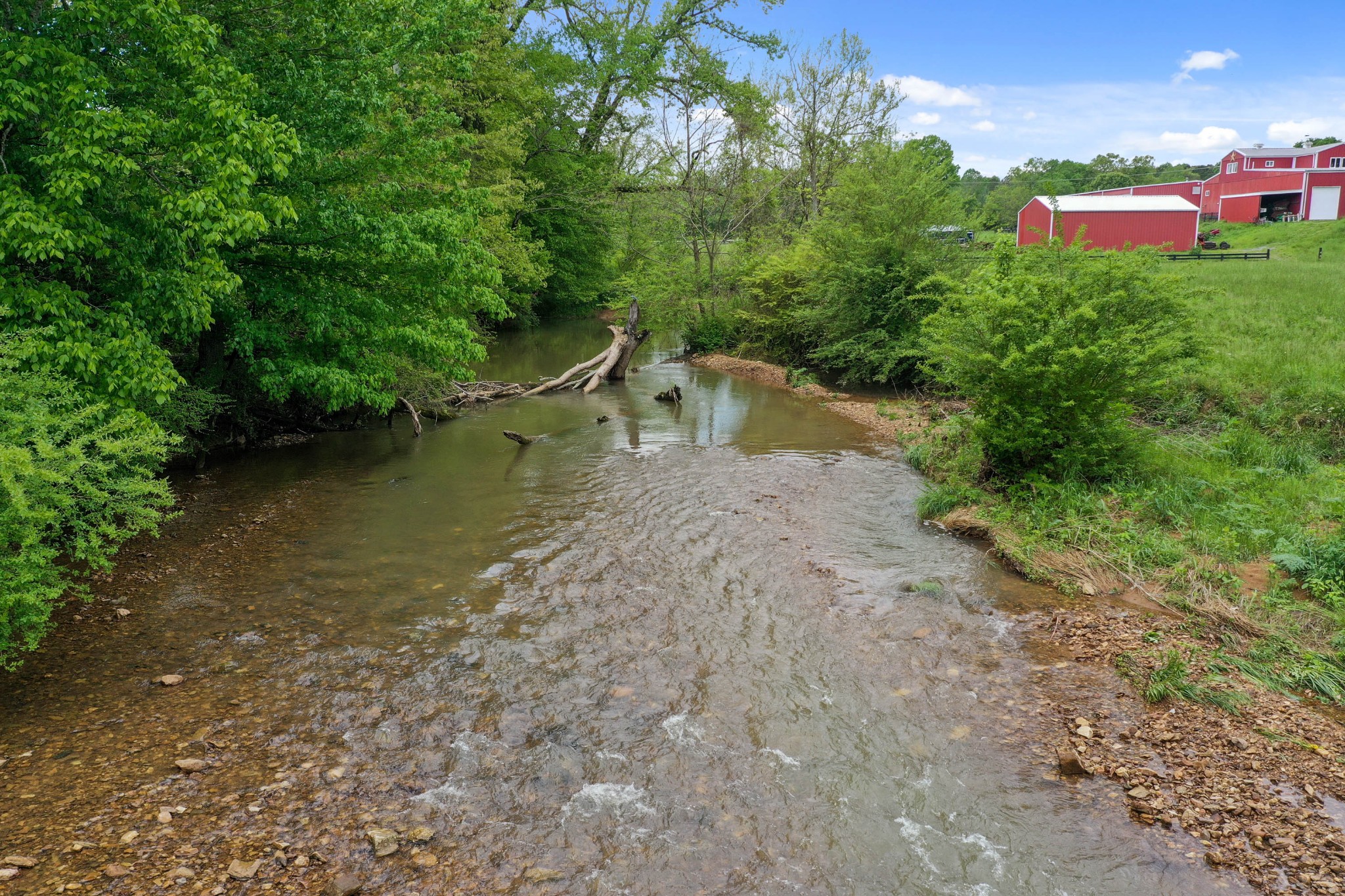 832 Jones Creek Road Dickson, TN 37055 - Photo 34 of 53 a view of a lake with a yard