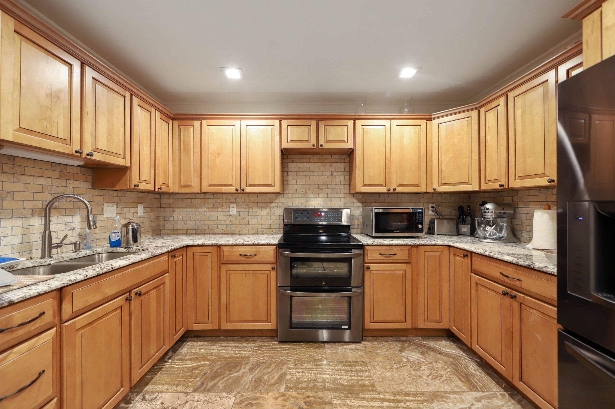 832 Jones Creek Road Dickson, TN 37055 - Photo 9 of 53 a kitchen with stainless steel appliances granite countertop a stove sink and cabinets