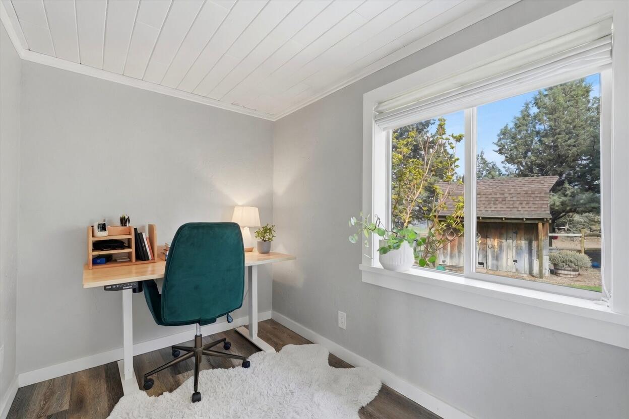 61280 Larsen Road Bend, OR 97702 - Photo 7 of 58 a workspace with furniture and a window