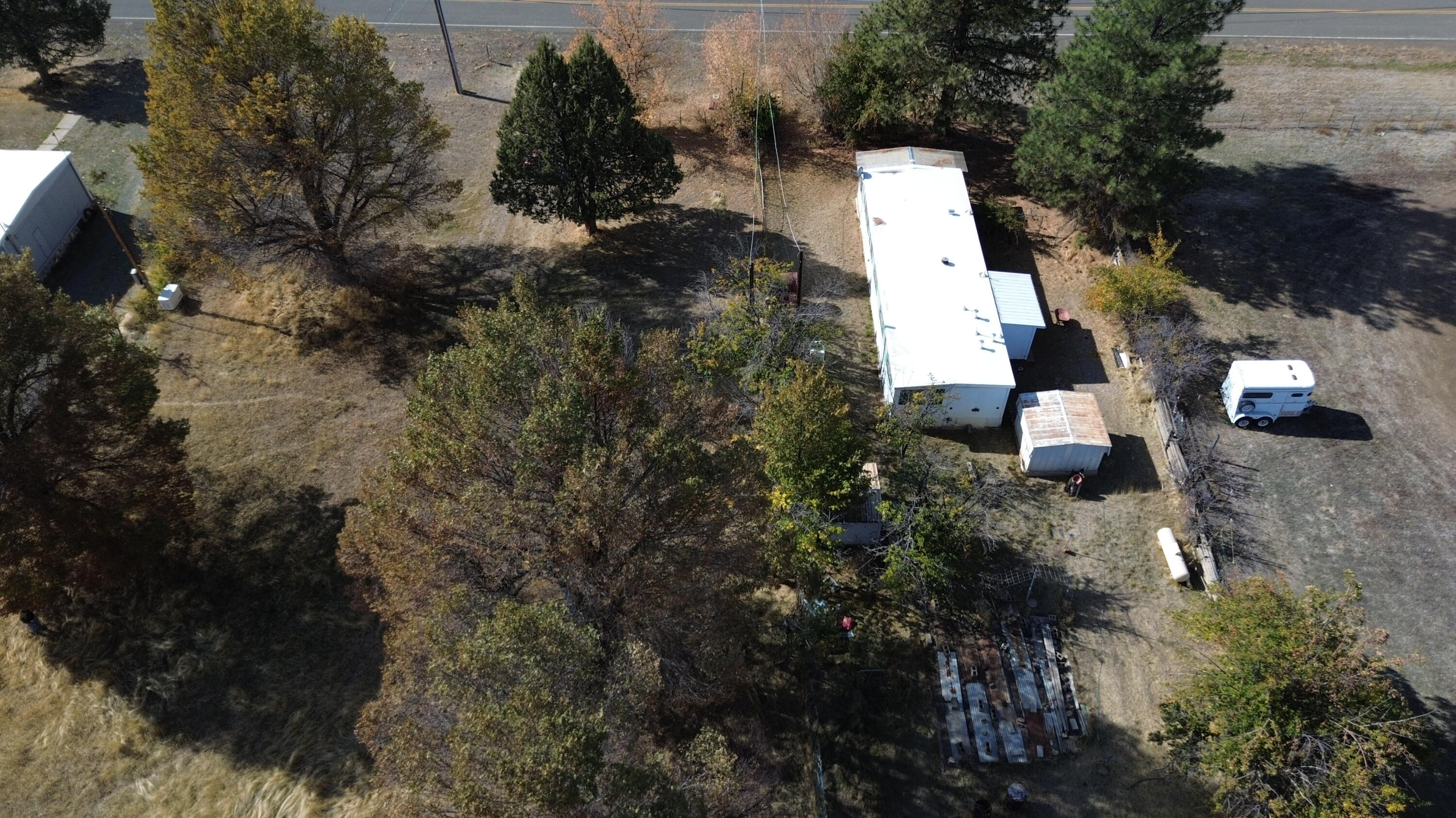 an aerial view of house with yard and mountain view