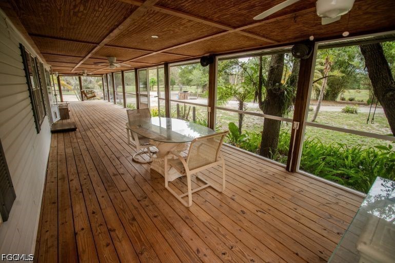 3880 Packinghouse Road Alva, FL 33920 - Photo 29 of 39 a view of a chairs and table on the wooden floor