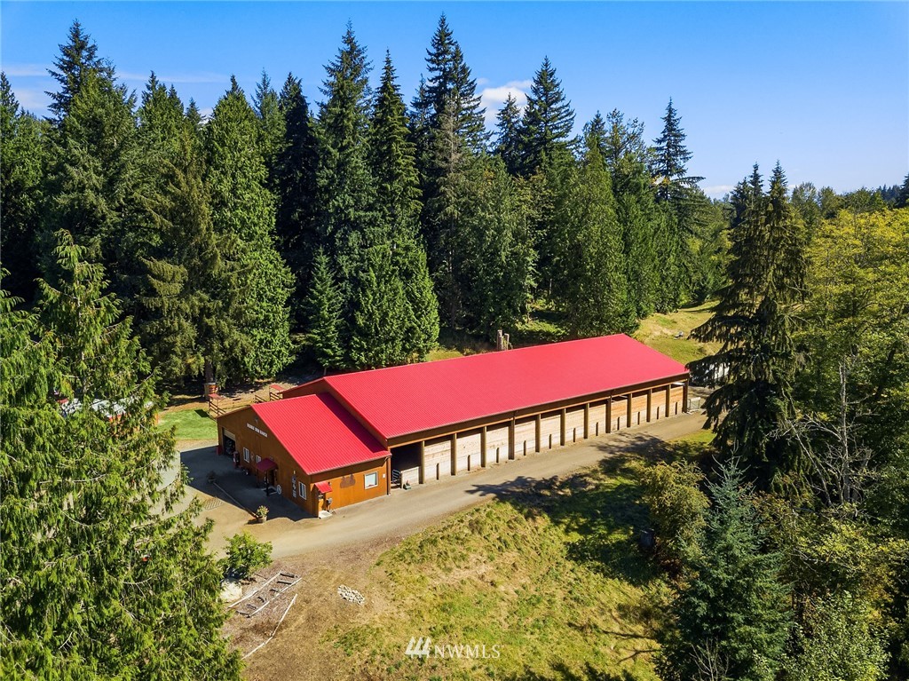 12105 Ingraham Road Snohomish, WA 98290 - Photo 22 of 30 an outdoor sitting area with red umbrella