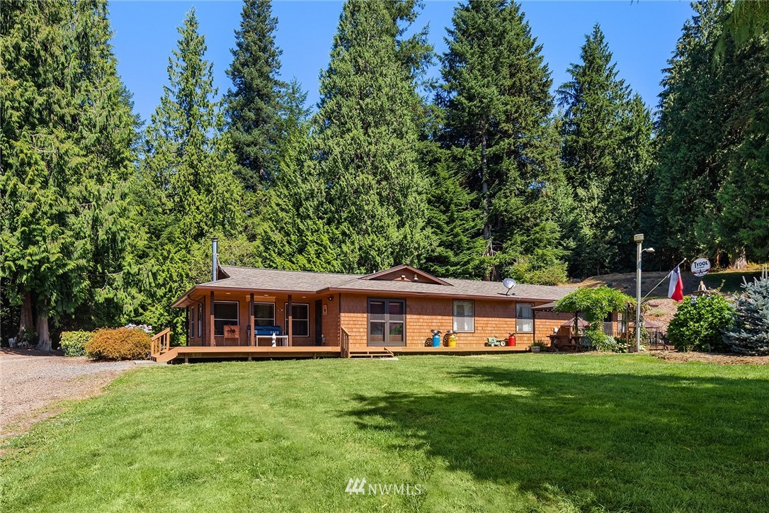 12105 Ingraham Road Snohomish, WA 98290 - Photo 8 of 30 a front view of a house with a garden and porch