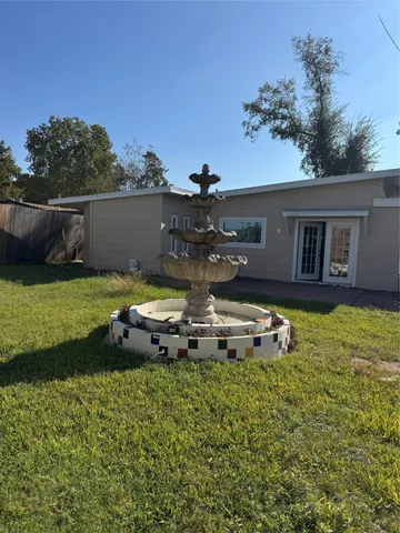 a view of a house with a big yard
