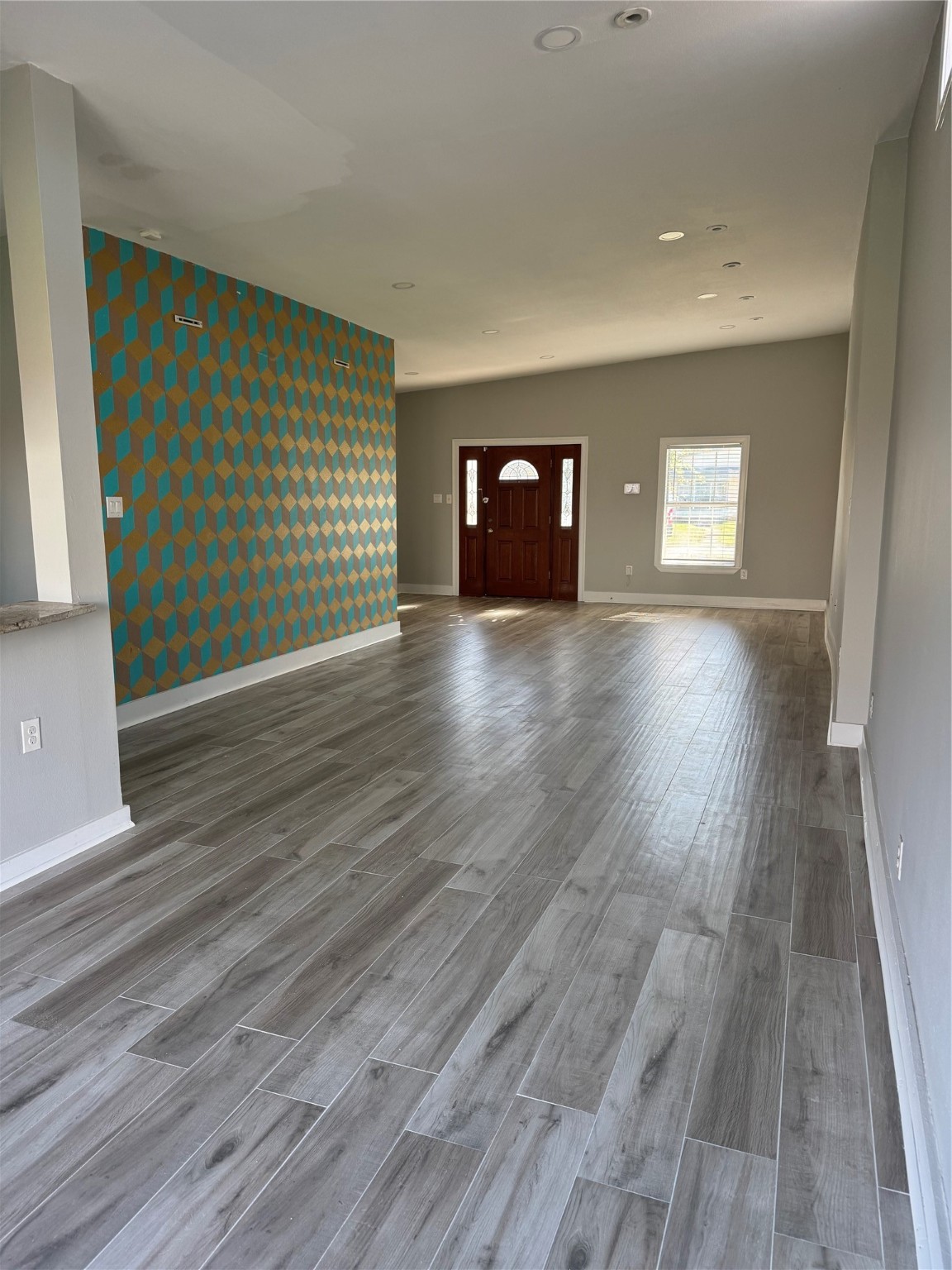 7526 Dearborn Street Houston, TX 77055 - Photo 2 of 11 a view of a livingroom with wooden floor and window