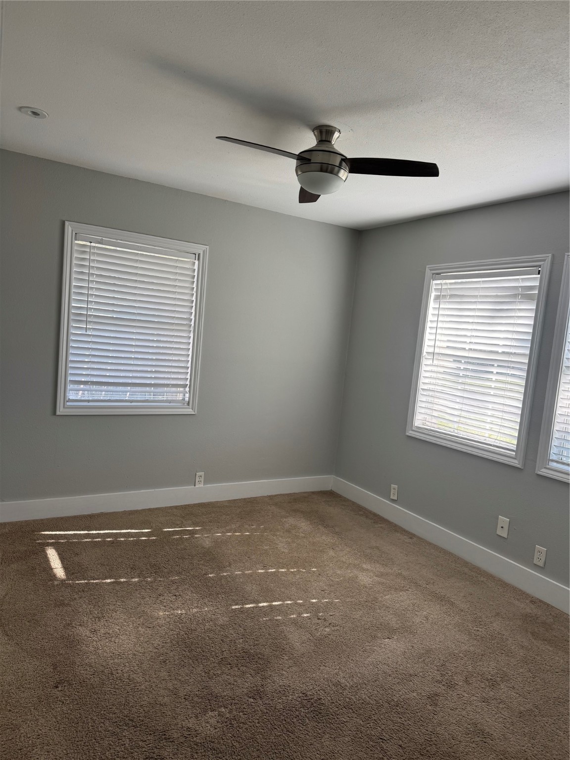 7526 Dearborn Street Houston, TX 77055 - Photo 4 of 11 a view of an empty room with a window