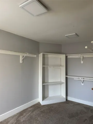 a view of an empty walk in closet