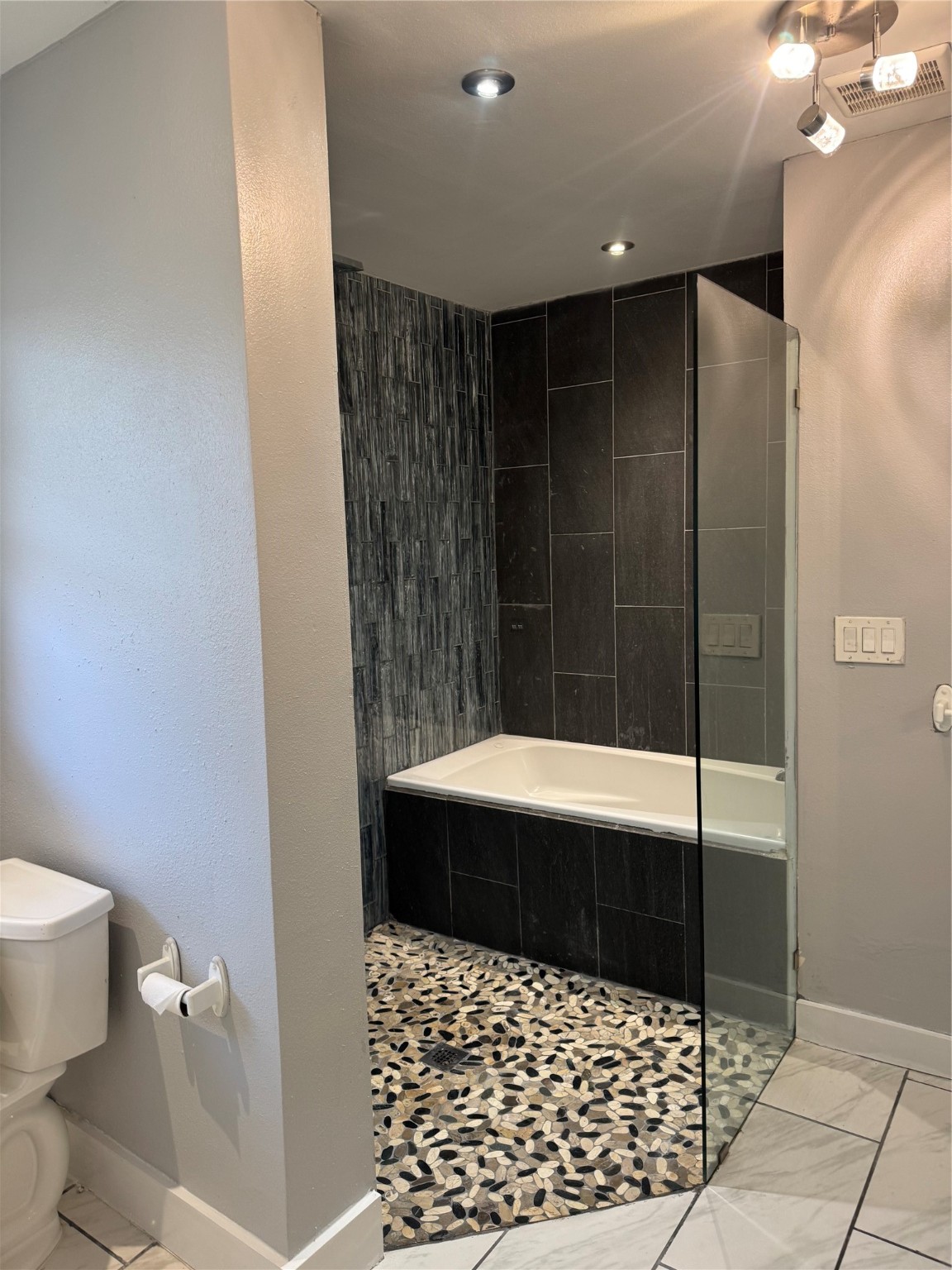 7526 Dearborn Street Houston, TX 77055 - Photo 9 of 11 a bathroom with a sink and a shower