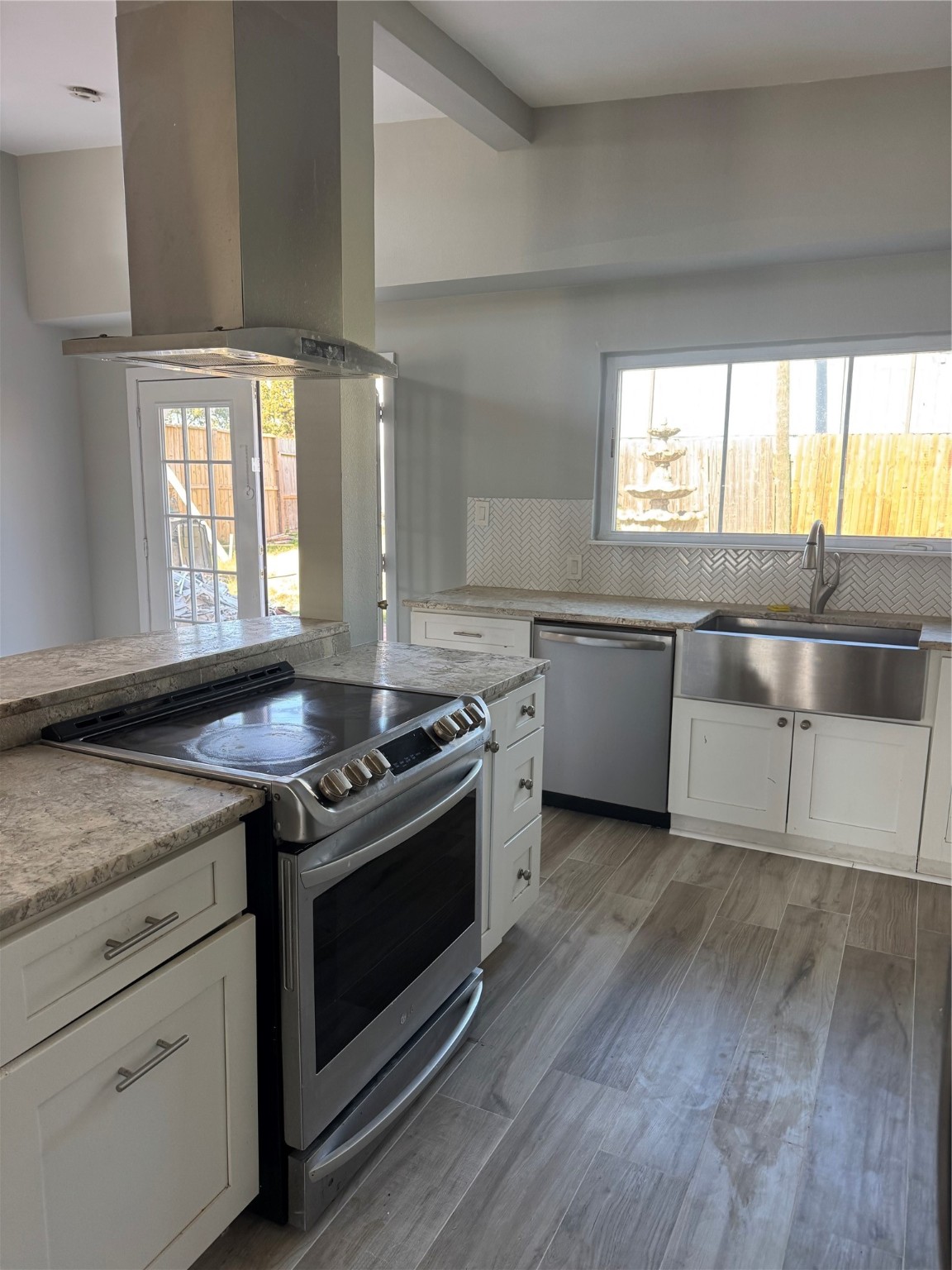 7526 Dearborn Street Houston, TX 77055 - Photo 10 of 11 a kitchen with a stove and a sink