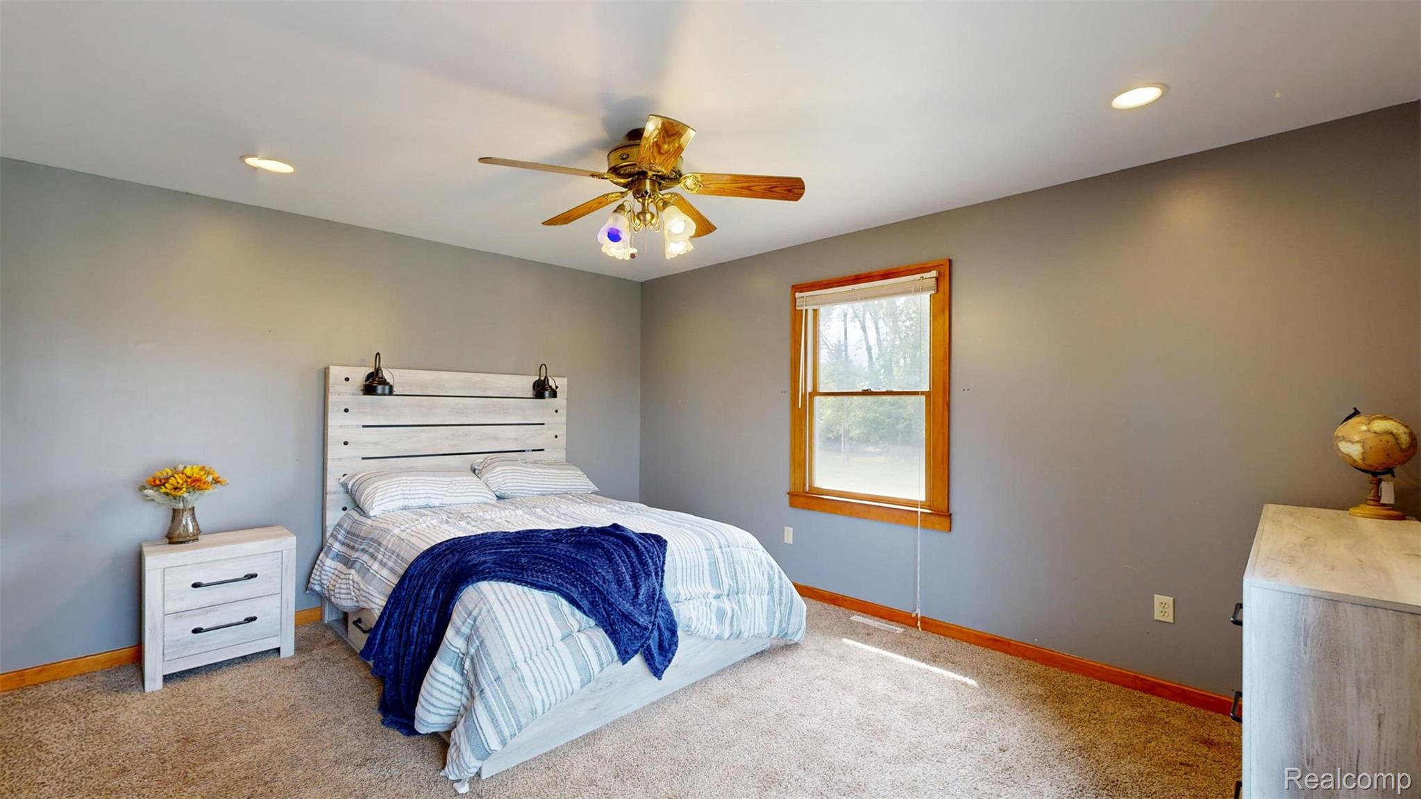 12930 Wilkinson Road Freeland, MI 48623 - Photo 57 of 76 Recessed lighting, ceiling fan with light fixture, carpeted flooring, and a window with wood trim