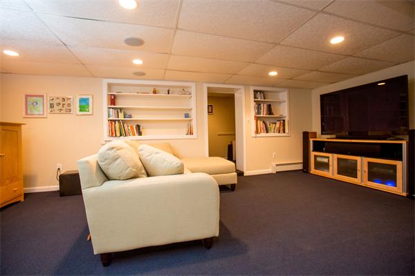 37 Longmeadow Road Wellesley, MA 02482 - Photo 18 of 24 a living room with furniture and a flat screen tv