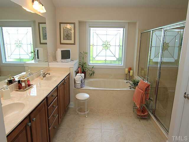 10537 Swerling Way Raleigh, NC 27614 - Photo 8 of 12 Elegant master bath with dual sinks, whirlpool tub and separate shower. Master Bath/Spa