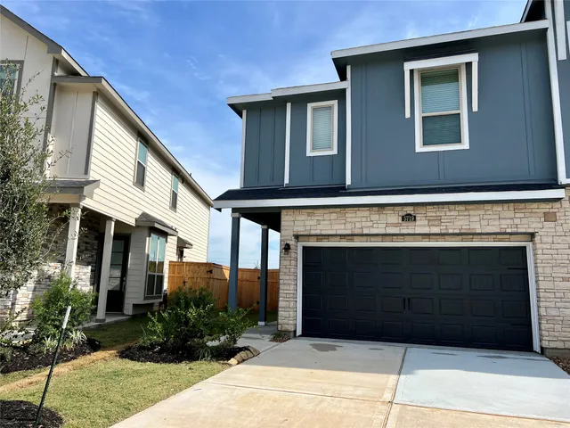 a front view of a house with a garage