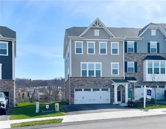 a large kitchen with a table and chairs