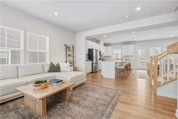 a dining room with furniture and window