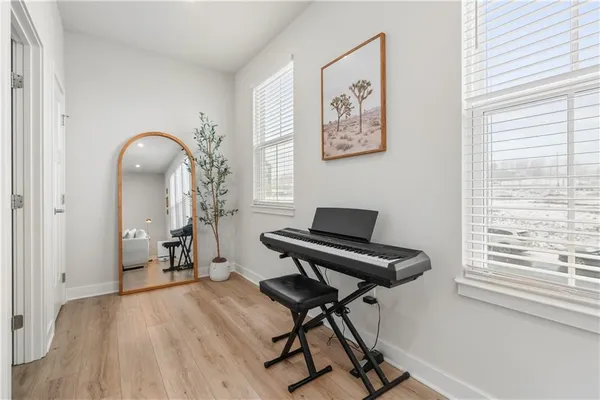 a bathroom with a sink mirror and toilet