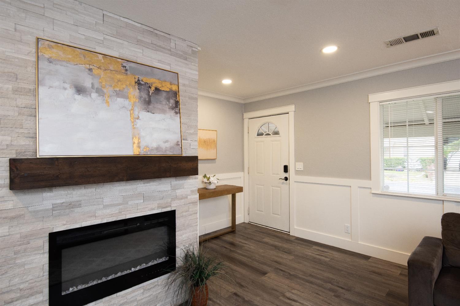 1405 Del Monte Avenue Modesto, CA 95350 - Photo 8 of 45 a living room with furniture and a fireplace