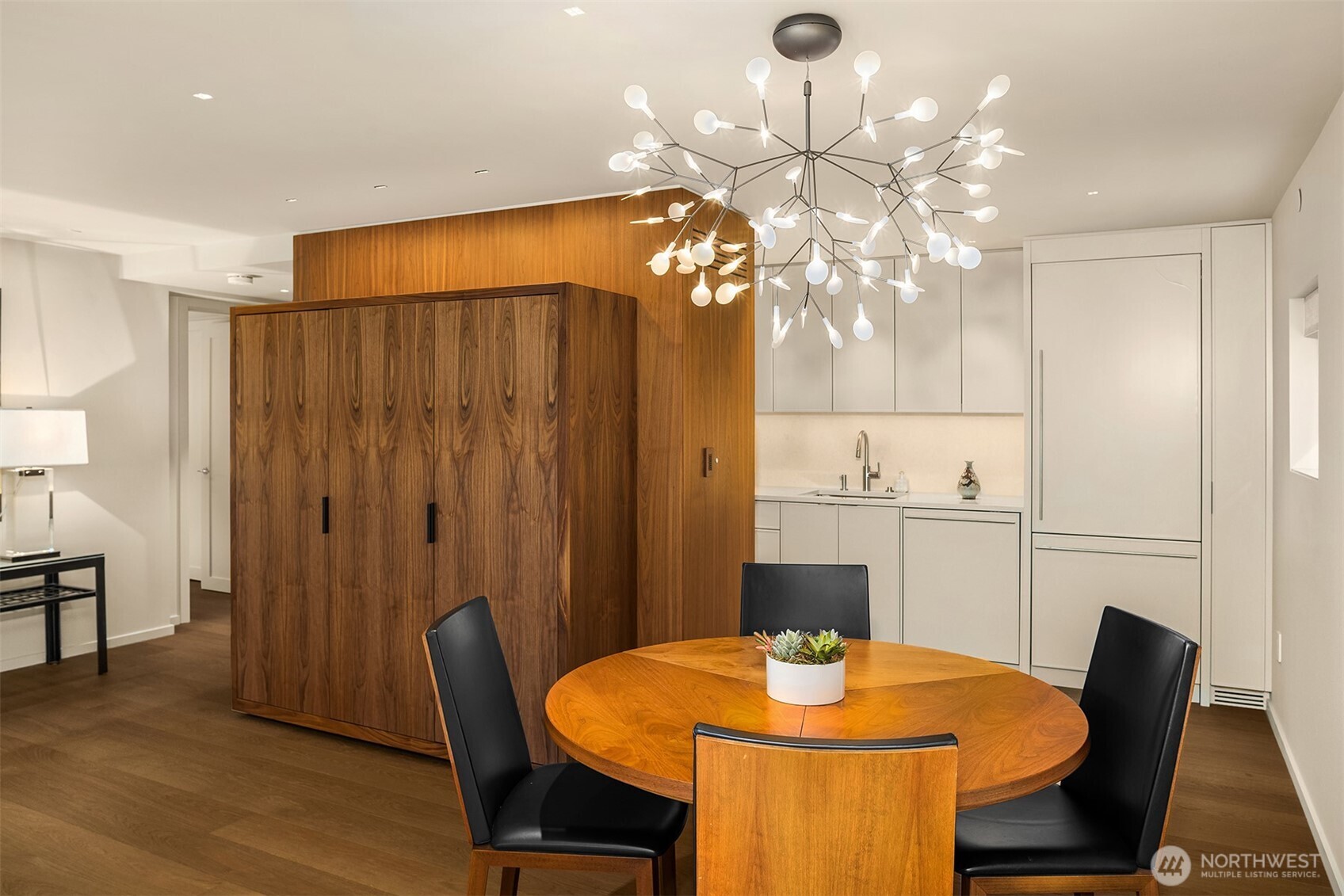 80 Vine Street, Unit 2600 Seattle, WA 98121 - Photo 27 of 40 a view of a dining room with furniture and wooden floor