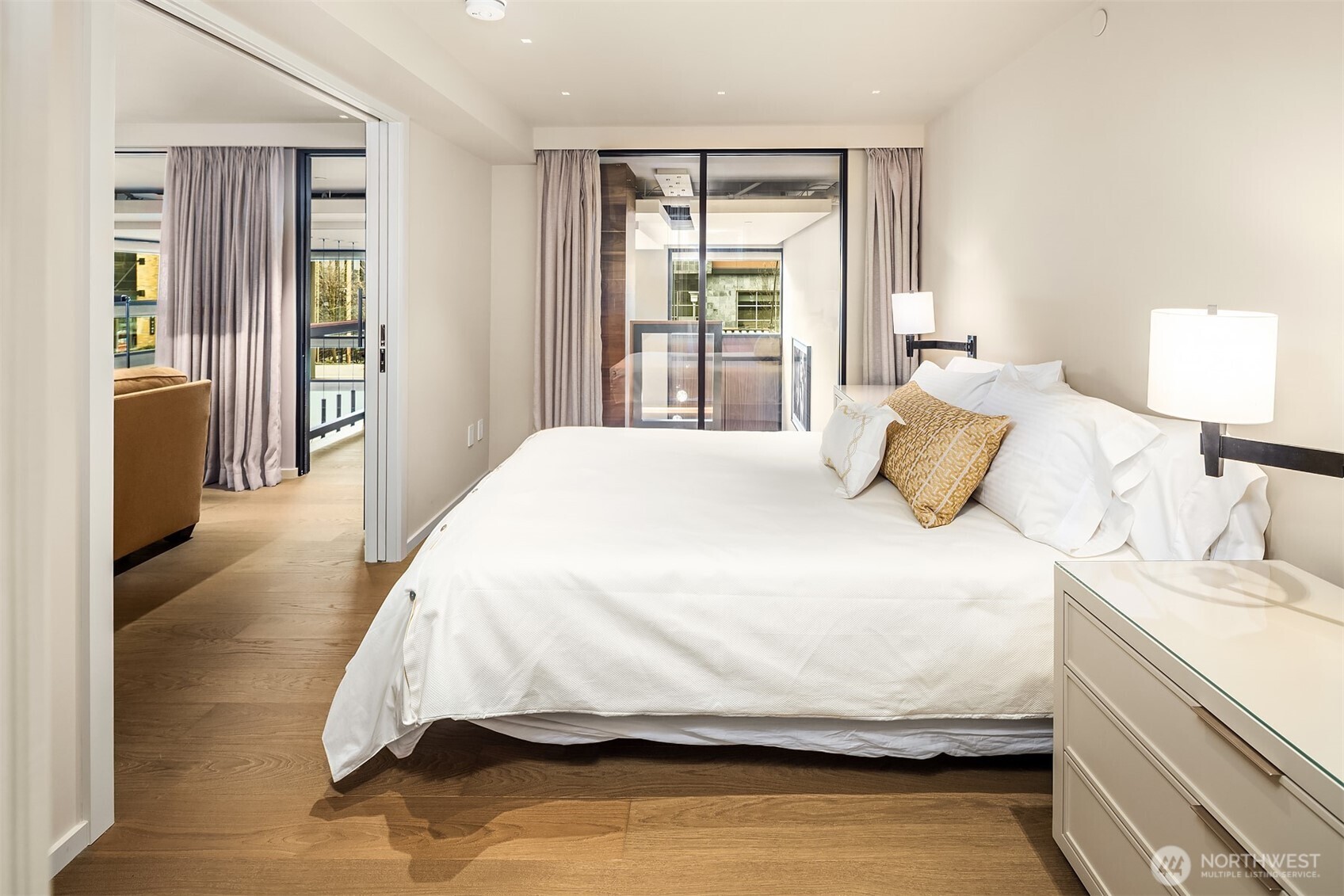 80 Vine Street, Unit 2600 Seattle, WA 98121 - Photo 29 of 40 a bedroom with a bed and wooden floor