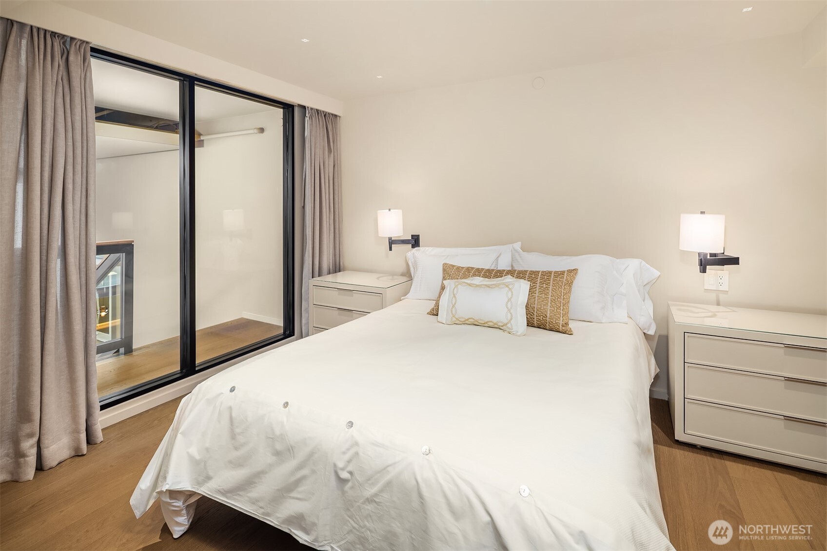 80 Vine Street, Unit 2600 Seattle, WA 98121 - Photo 31 of 40 a bedroom with a bed and a large mirror