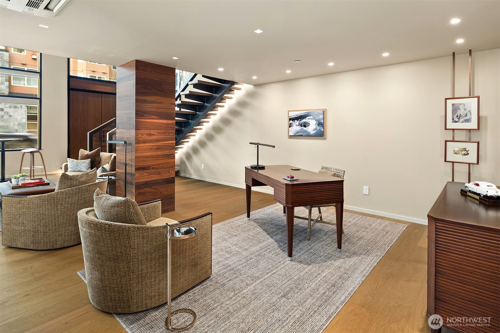 80 Vine Street, Unit 2600 Seattle, WA 98121 - Photo 7 of 40 a living room with couches and a flat screen tv with kitchen view