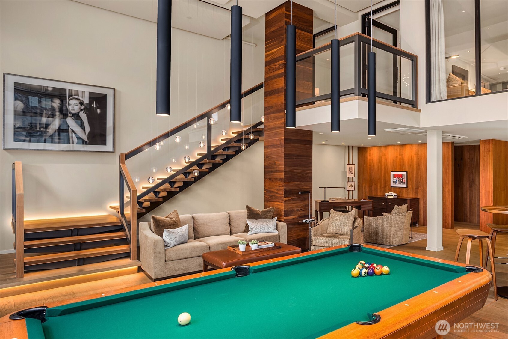 80 Vine Street, Unit 2600 Seattle, WA 98121 - Photo 10 of 40 a living room with furniture pool table chairs and windows