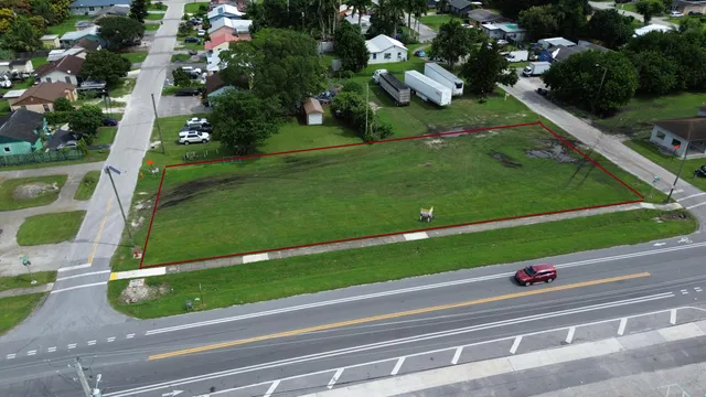 a view of a yard with table and potted plants