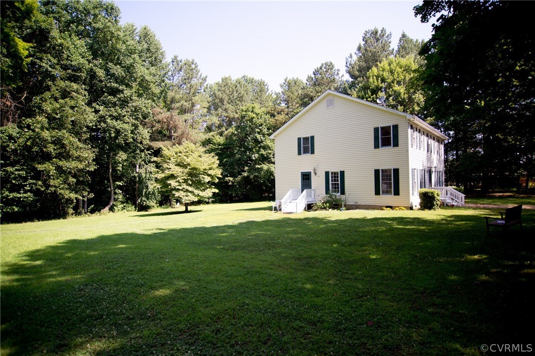 1343 Old Ridge Road Farmville, VA 23901 - Photo 2 of 31 a view of a white house in front of a big yard with large trees