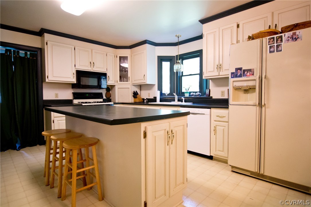 1343 Old Ridge Road Farmville, VA 23901 - Photo 6 of 31 a kitchen with stainless steel appliances granite countertop a sink refrigerator and microwave