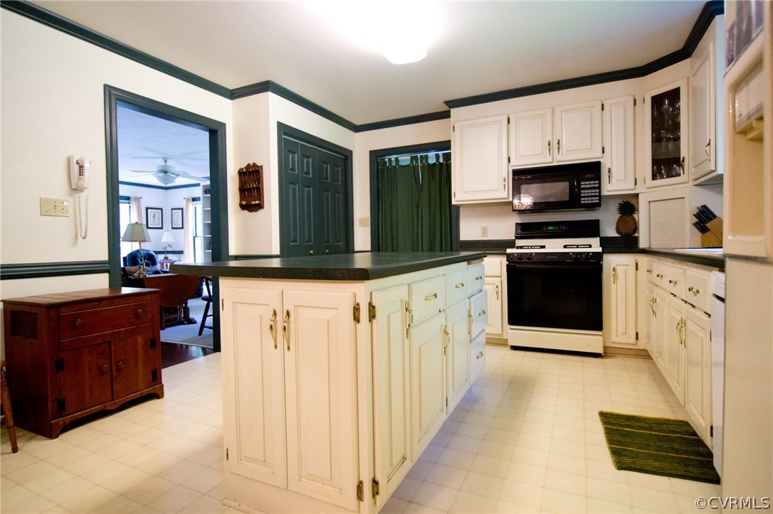 1343 Old Ridge Road Farmville, VA 23901 - Photo 7 of 31 a large kitchen with stainless steel appliances granite countertop a stove and a sink