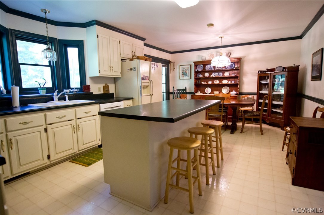 1343 Old Ridge Road Farmville, VA 23901 - Photo 9 of 31 a kitchen with cabinets and chairs