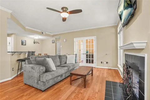 a living room with furniture and a fireplace