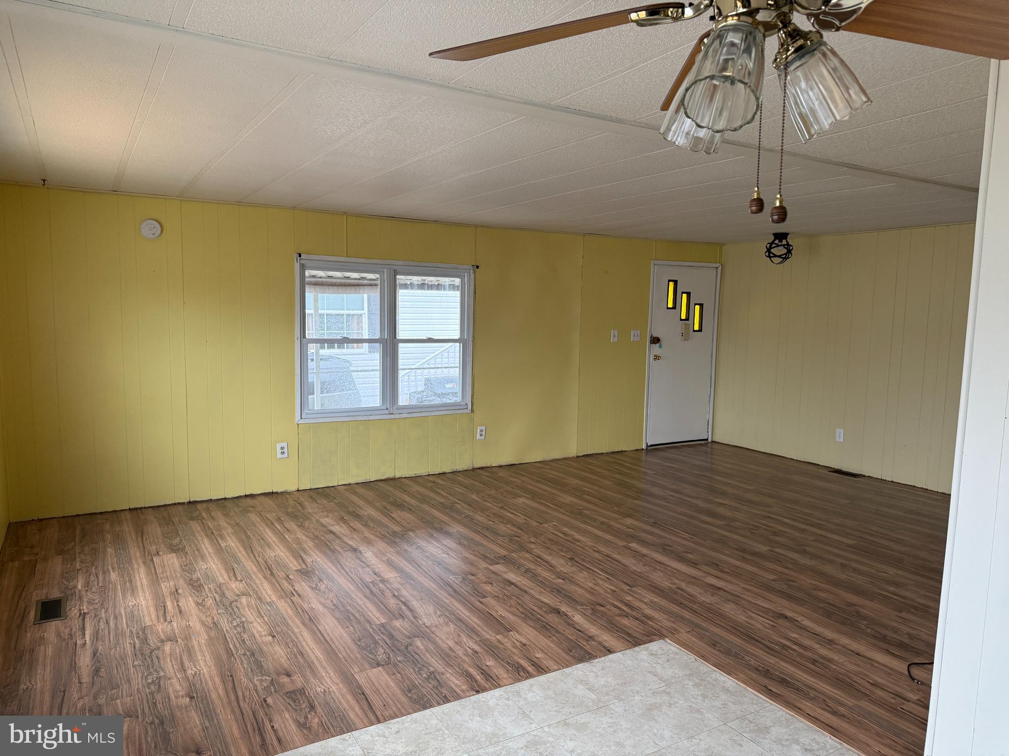 187 Rita Place Williamstown, NJ 08094 - Photo 13 of 20 a view of empty room with wooden floor
