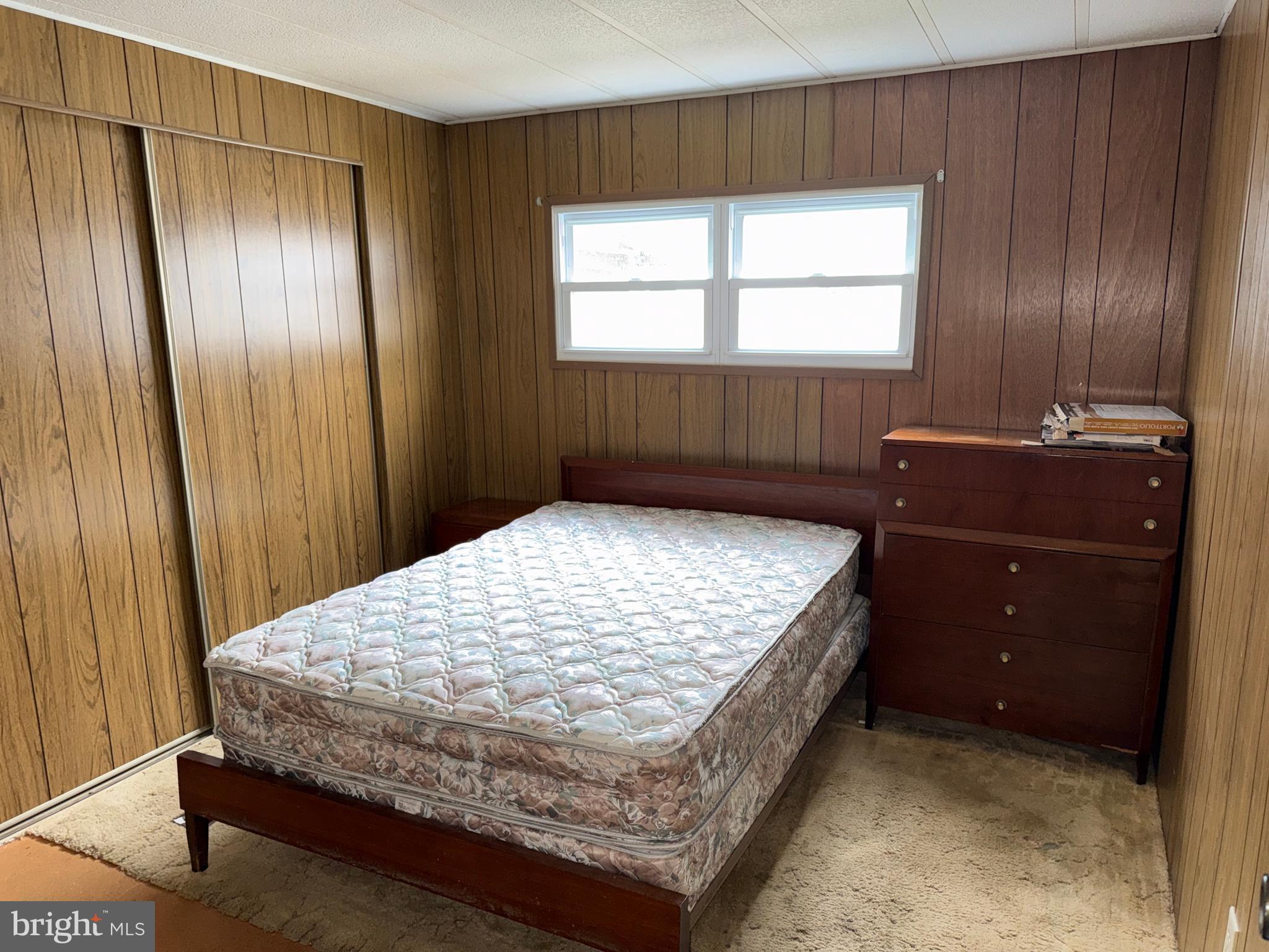 187 Rita Place Williamstown, NJ 08094 - Photo 16 of 20 a bed sitting in a bedroom next to a window and dresser