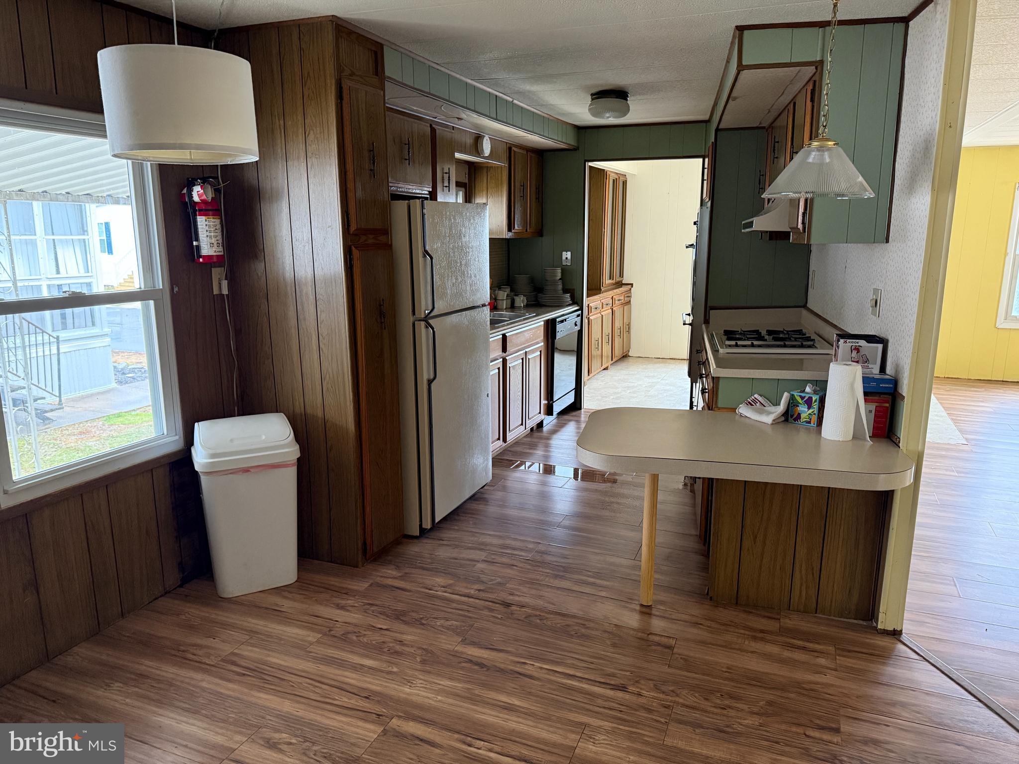 187 Rita Place Williamstown, NJ 08094 - Photo 7 of 20 a kitchen with refrigerator cabinets and wooden floor