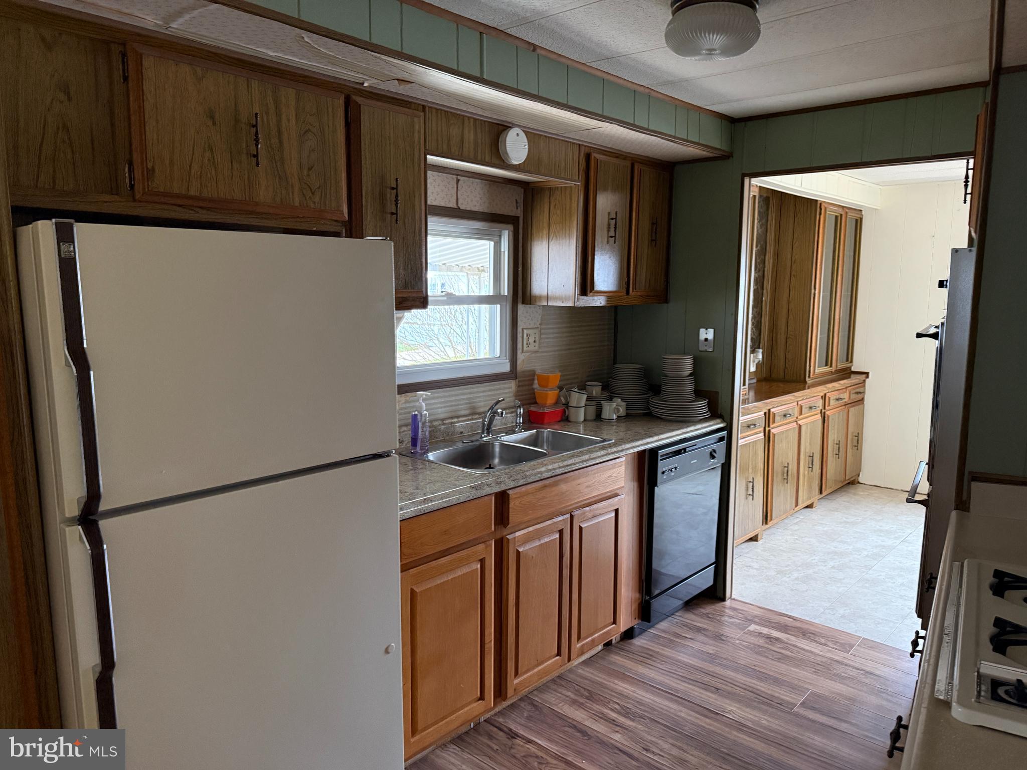 187 Rita Place Williamstown, NJ 08094 - Photo 9 of 20 a kitchen with stainless steel appliances granite countertop a refrigerator a stove and a sink