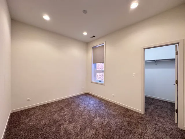 an empty room with a empty space and windows