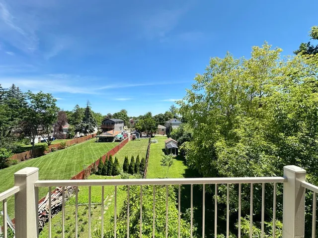 a view of a garden and deck
