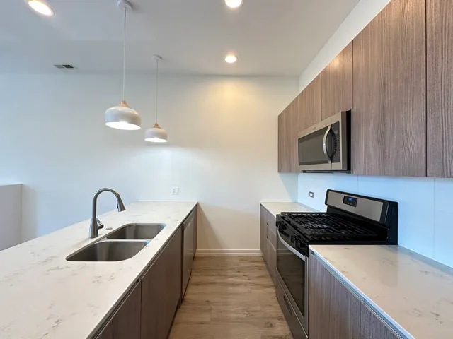 a kitchen with a sink and a microwave