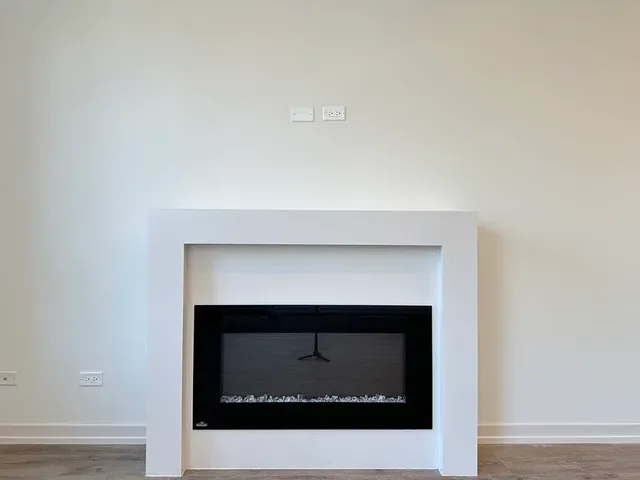 a fireplace with a hallway